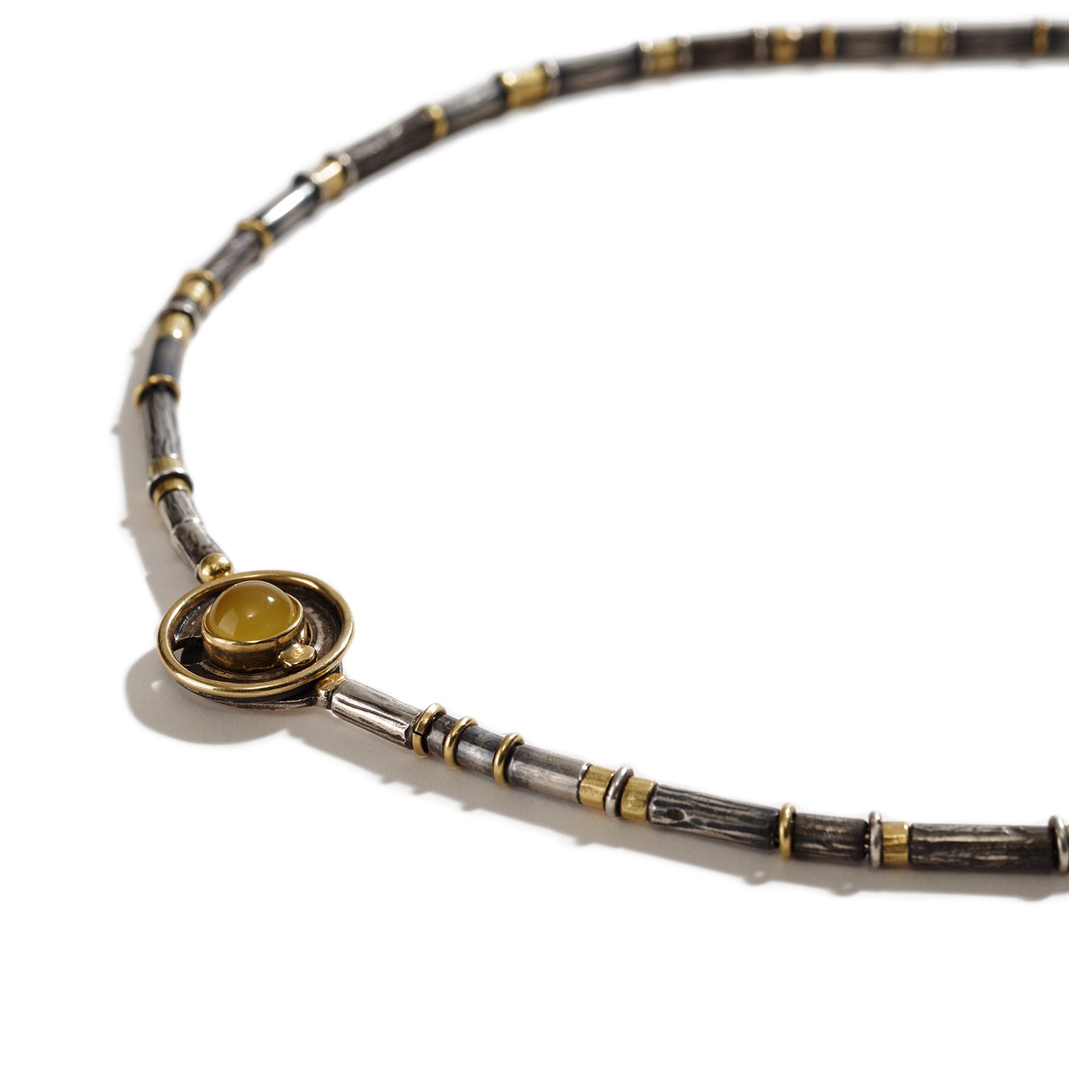 Necklace in Gold, Silver, Yellow, and Black Stones